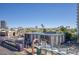 Scenic view from the balcony, with a modern tram, palm trees and mountain range in the distance at 2302 N Central Ave # 412, Phoenix, AZ 85004