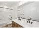 Bright bathroom featuring a double sink vanity, framed mirror and shower-tub combo at 26029 N 23Rd Ave, Phoenix, AZ 85085