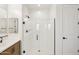 Modern bathroom with glass-enclosed shower and sleek black fixtures at 26029 N 23Rd Ave, Phoenix, AZ 85085