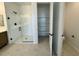 Modern bathroom featuring a glass enclosed shower and a separate linen closet at 26029 N 23Rd Ave, Phoenix, AZ 85085