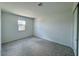 Cozy bedroom with neutral carpet, a window, and closet space at 26029 N 23Rd Ave, Phoenix, AZ 85085