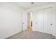 Bedroom with carpet, a closet, and a doorway leading to a bathroom at 26029 N 23Rd Ave, Phoenix, AZ 85085