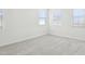 Bright bedroom with carpet and three windows at 26029 N 23Rd Ave, Phoenix, AZ 85085