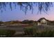 Union Park entrance with dark sky, mountain views, and manicured bushes at 26029 N 23Rd Ave, Phoenix, AZ 85085