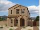 Charming two-story home with tan stucco exterior and landscaped front yard at 26029 N 23Rd Ave, Phoenix, AZ 85085