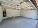 Spacious two car garage featuring epoxy flooring and a storage area at 26029 N 23Rd Ave, Phoenix, AZ 85085