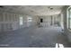 Spacious, unfinished great room area featuring bright windows at 26029 N 23Rd Ave, Phoenix, AZ 85085