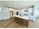 Modern kitchen featuring an island, stainless steel appliances, and ample cabinet space at 26029 N 23Rd Ave, Phoenix, AZ 85085