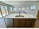 Spacious kitchen island with a sink, dishwasher, and ample counter space at 26029 N 23Rd Ave, Phoenix, AZ 85085