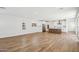 Bright, open-concept living space features beautiful wood flooring and abundant natural light at 26029 N 23Rd Ave, Phoenix, AZ 85085