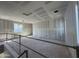 Unfinished loft area showcasing bright windows and high ceilings at 26029 N 23Rd Ave, Phoenix, AZ 85085