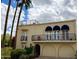 Stunning exterior with balconies, arched garage, and lush landscaping at 2637 E Beekman Pl, Phoenix, AZ 85016