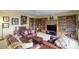 Spacious living room with a cozy feel, featuring custom bookcases and cabinetry, providing ample storage and style at 2637 E Beekman Pl, Phoenix, AZ 85016