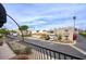 A view from a balcony showcasing the street featuring beautiful desert landscaping, blue skies, and well-kept homes at 2637 E Beekman Pl, Phoenix, AZ 85016