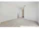 A carpeted bedroom featuring white walls with two entry doors and overhead lighting at 28958 N 174Th Ln, Surprise, AZ 85387