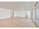 Bright living room featuring tile floors, white walls, and sliding glass doors at 28958 N 174Th Ln, Surprise, AZ 85387