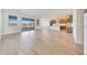 Bright, open-concept living room with wood-look tile flooring and natural light at 28958 N 174Th Ln, Surprise, AZ 85387