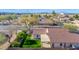 Aerial view of a home with a terracotta roof, well-maintained landscaping, and a cozy patio at 3037 S Coyote Cyn, Mesa, AZ 85212