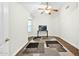 Cozy bedroom with neutral walls, hardwood floors, and a window providing natural light at 3037 S Coyote Cyn, Mesa, AZ 85212