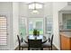 Bright dining area with a round table, perfect for enjoying meals with a view of the outdoors at 3037 S Coyote Cyn, Mesa, AZ 85212