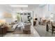 Bright living room with neutral tones, tile floors, and sliding glass doors to the outdoor patio at 3038 E Marlette Ave, Phoenix, AZ 85016