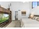 The main bedroom features a media center and a doorway with access to the rest of the home at 3038 E Marlette Ave, Phoenix, AZ 85016