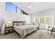 Spacious main bedroom featuring a large window, ceiling fan, and an exercise bike overlooking the pool at 3038 E Marlette Ave, Phoenix, AZ 85016