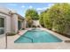 Backyard pool surrounded by lush landscaping offering privacy and a peaceful oasis for relaxation at 3038 E Marlette Ave, Phoenix, AZ 85016