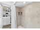 Luxurious shower and closet with custom built-ins for storage at 3038 E Marlette Ave, Phoenix, AZ 85016