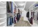 Organized walk-in closet with built-in shelves and racks for ample storage, and full-length mirror at 3038 E Marlette Ave, Phoenix, AZ 85016