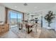 Open concept dining room next to a modern kitchen and sliding doors to a covered patio at 3315 S Lotus St, Mesa, AZ 85212