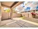 This is a covered back patio, featuring concrete pavers and partial turf at 34916 N 31St Ave, Phoenix, AZ 85086