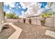 Backyard with stone, some artificial grass and a block fence at 34916 N 31St Ave, Phoenix, AZ 85086