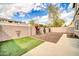 Backyard with artificial turf and a block fence for privacy at 34916 N 31St Ave, Phoenix, AZ 85086