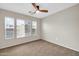 Bedroom with large windows and blinds to bring in natural light at 34916 N 31St Ave, Phoenix, AZ 85086