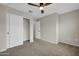 Bedroom with a ceiling fan, closet and neutral colors at 34916 N 31St Ave, Phoenix, AZ 85086