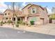 Charming exterior view of a two story home with stone accents and desert landscaping at 34916 N 31St Ave, Phoenix, AZ 85086