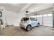 This is a garage interior featuring a car and ample storage space at 34916 N 31St Ave, Phoenix, AZ 85086