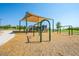 Well-maintained community playground featuring swings, slides, and covered play structures for children at 34916 N 31St Ave, Phoenix, AZ 85086