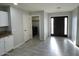 Interior view of the house featuring a laundry room, and new tile floors at 4002 N 58Th Dr, Phoenix, AZ 85031