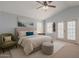 Bright bedroom with neutral tones, a ceiling fan, and balcony access through French doors at 4033 E Wildcat Dr, Cave Creek, AZ 85331