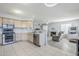 Spacious kitchen featuring ample cabinetry, stainless steel appliances and a view into the adjacent living room at 4033 E Wildcat Dr, Cave Creek, AZ 85331