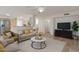 Bright living room with neutral furniture, wood floors, and an open floor plan into the kitchen area at 4033 E Wildcat Dr, Cave Creek, AZ 85331