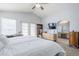 Bright main bedroom with a ceiling fan, ensuite bath, and carpet flooring at 4033 E Wildcat Dr, Cave Creek, AZ 85331