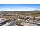 Aerial view of homes in a desert neighborhood, with mountain views in the distance at 41802 N Bridlewood Way, Anthem, AZ 85086