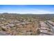 Expansive aerial view of a residential neighborhood showcasing single-Gathering homes, desert vegetation, and community amenities at 41802 N Bridlewood Way, Anthem, AZ 85086