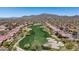 Expansive aerial view highlighting the golf course winding through the residential community at 41802 N Bridlewood Way, Anthem, AZ 85086