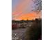 Picturesque desert sunset view from the fenced backyard, showcasing the natural beauty of the area at 41802 N Bridlewood Way, Anthem, AZ 85086