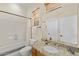 Full bathroom with granite countertops, framed mirror and tiled shower and tub at 41802 N Bridlewood Way, Anthem, AZ 85086