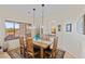 Dining room showcasing wood table set on an area rug beneath pendant lights at 41802 N Bridlewood Way, Anthem, AZ 85086